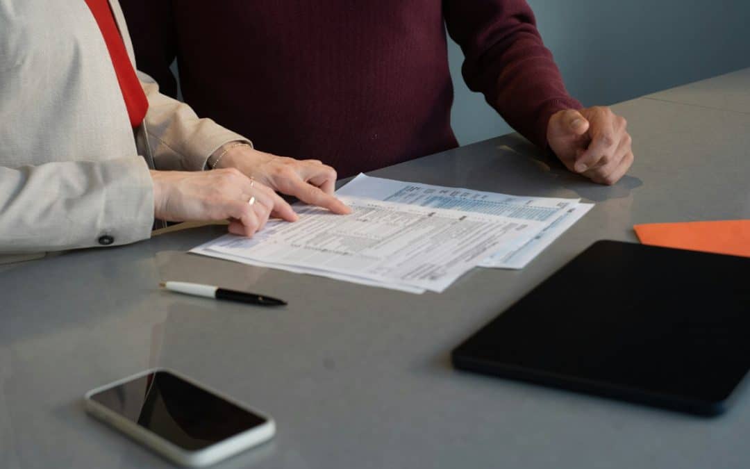 Couple calmly reviewing financial documents together during an amicable separation